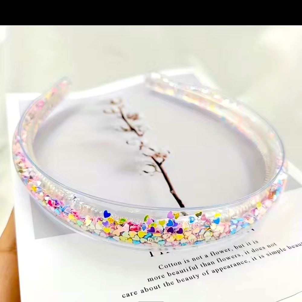 New transparent quicksand headband with mini sequin hearts.